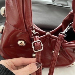 Retro burgundy patent leather underarm bag with silver studs and adjustable strap