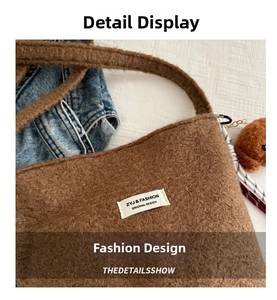 Close-up of brown plush bucket bag with cute bear charm and woven label detail