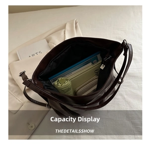 Interior view of soft brown leather tote bag showing large capacity for daily items