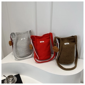 Winter wool bucket bags in grey red and brown with plush bear charms and fuzzy texture