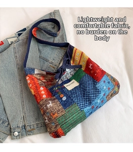 Detailed close-up of ethnic patchwork tote bag with colorful geometric patterns and deer motifs