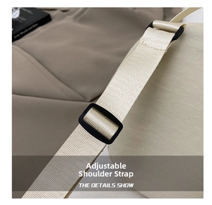 Macro detail of beige nylon adjustable strap with black slider for crossbody bag
