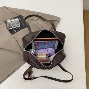 Deep brown matte leather tote bag showing large capacity for iPad and daily essentials