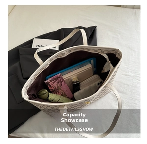 Interior view showing large capacity of the tote bag with umbrella, tablet and wallet