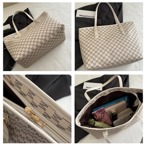 Detail view of large printed tote bag with zipper closure and spacious interior storage