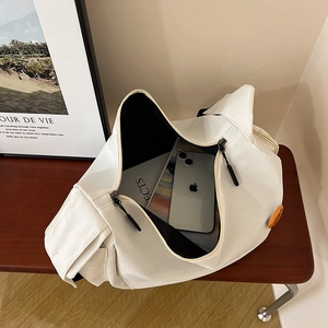Minimalist white nylon messenger bag with large capacity and smooth dual zippers