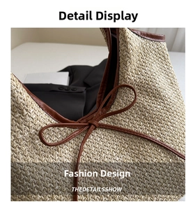 Close-up of beige woven straw tote bag with brown leather trim and bow detail