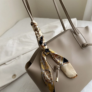 Minimalist beige tote bag with decorative vintage pattern silk scarf and drawstring detail