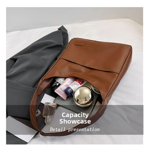 Detailed interior of a large brown tote bag showing ample space for daily essentials