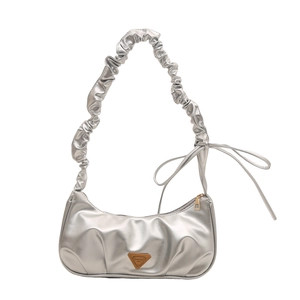 Silver metallic moon bag with pleated handle and ribbon detail in a front view