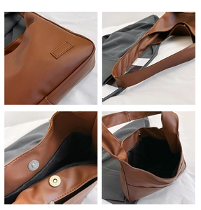 Macro details of vintage brown leather tote bag showing silver magnetic closure and strap
