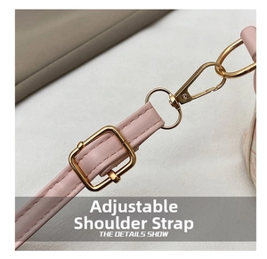 Detail of pink PU leather shoulder strap with adjustable golden metal buckle and hook