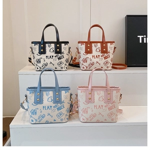 Detailed set of four graffiti print bucket bags in black, brown, blue, and pink colors