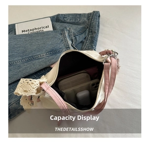 Detail view of large capacity tote bag interior with quilted wallet and smartphone