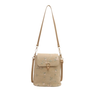Borsa a secchiello in paglia beige con ricamo floreale e chiusura in metallo oro