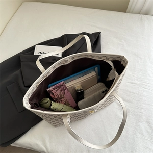 Off-white large capacity underarm tote bag with M-pattern print showing spacious interior