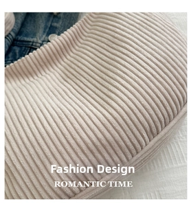 Detail of soft cream corduroy fabric texture with stylish ribbed pattern finish
