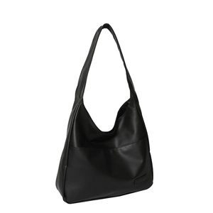 Black matte PU leather hobo tote bag with wide shoulder strap in a minimalist design