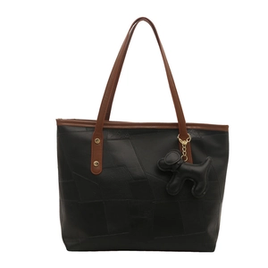 Large capacity black leather tote bag with brown straps and a dog charm pendant