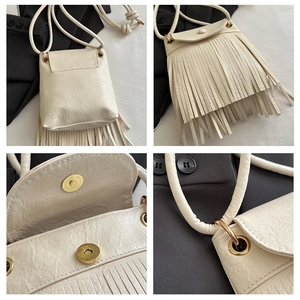 Detail of cream tassel crossbody bag showing textured leather and gold magnetic closure