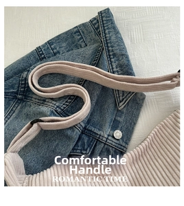 Close-up of corduroy shoulder bag strap and texture with romantic time lettering