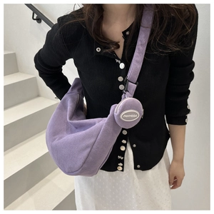 Detail of lavender corduroy crescent bag with a small round detachable coin purse pouch
