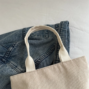 Japanese style beige corduroy tote bag with soft texture and wide fabric handles