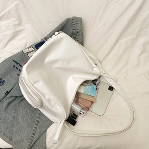 Minimalist white large-capacity tote bag in smooth leather showing interior storage space