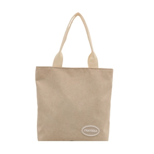 Japanese style corduroy tote bag with brown leather logo patch on minimalist white background