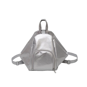 Silver geometric backpack with metallic finish featuring adjustable straps and front pocket