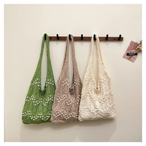 Detailed knit tote bags with hollow wave patterns and elegant pearl embellishments