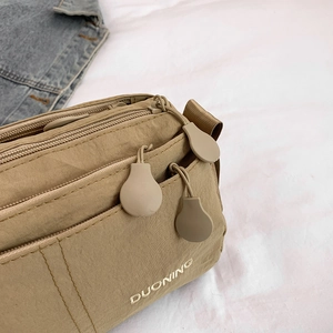 Borsa a tracolla moderna in nylon kaki con tasche con zip multistrato e ricamo Duoning