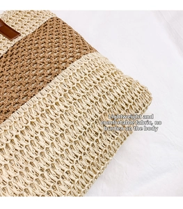 Detailed close-up of woven straw texture with beige and brown stripes on beach bag
