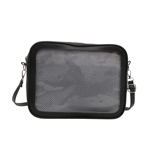 Minimalist black ita bag with gray honeycomb mesh window and adjustable strap