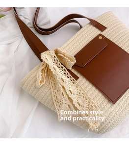 Detail of beige woven tote bag with brown leather pocket and delicate lace bow accent