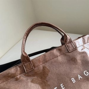 Brown large capacity waterproof tote bag with textured finish and reinforced handles