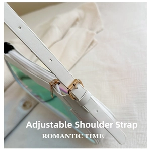 Close-up of adjustable leather shoulder strap with gold buckle on iridescent handbag