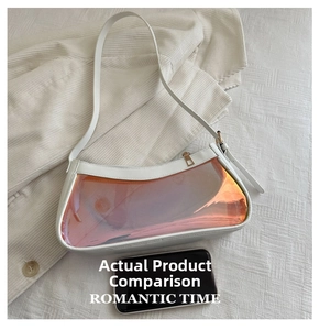 Detail of white leather shoulder bag featuring an iridescent orange transparent panel insert