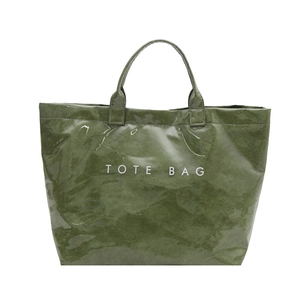 Glossy green Tyvek tote bag with white TOTE BAG print and textured finish