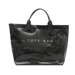 Large black glossy tote bag with white TOTE BAG text print in a minimalist design