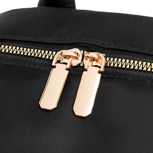 Quilted backpack with premium gold metal zippers and durable black fabric detail