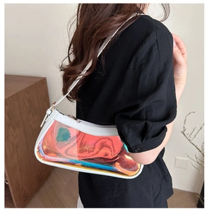 Close-up of white leather frame and iridescent clear PVC panel on the trendy underarm bag
