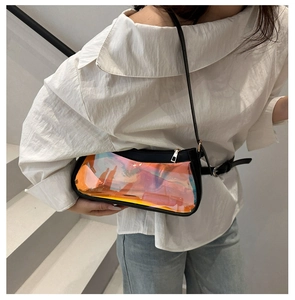 Holographic TPU rainbow shoulder bag with black leather straps shown on a model