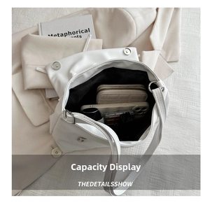 Internal view of white PU tote bag showing large capacity for wallet and phone
