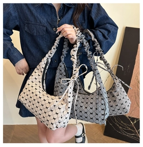 Detail of checkered canvas bags with bow patterns and ruffled straps for women