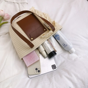 Large capacity woven straw tote bag with brown leather handles and white lace trim
