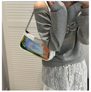 Iridescent laser transparent shoulder bag with white trim shown as a stylish lifestyle view