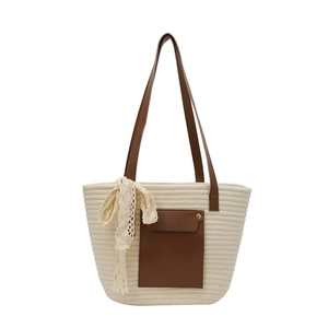 Handwoven cream cotton tote bag with brown leather straps and elegant lace bow detail