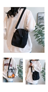 Detail view of stylish square crossbody bags in black canvas and transparent PVC materials