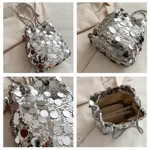 Macro detail of silver sequin bucket bag showing drawstring closure and large interior capacity